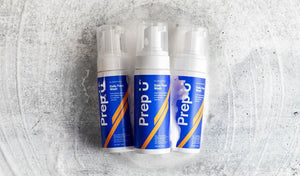 Three bottles of Prep u Daily Face Wash on a textured surface for men's skincare routine.