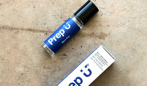 Prep U blemish stick and packaging on a textured surface, perfect for acne treatment.