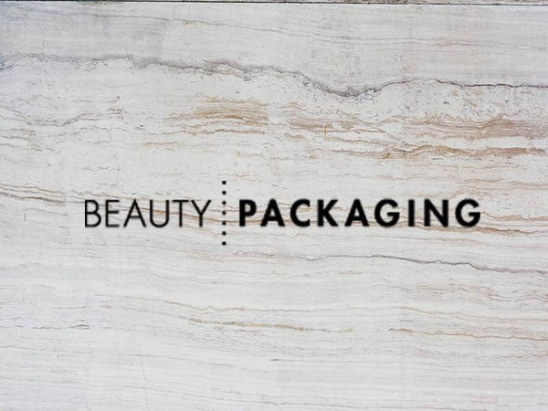 Stylish logo of Beauty Packaging on a textured stone background.