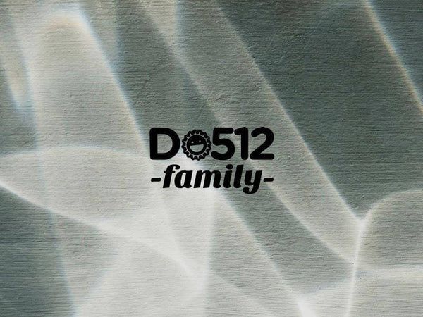 DO512 Family logo displayed on a textured background with light reflections.