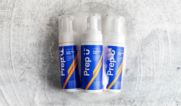 Three bottles of Prep u Daily Face Wash on a textured surface for men's skincare routine.