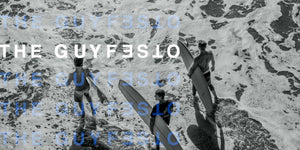 Three surfers wading in ocean waves, embodying freedom and adventure in outdoor play and the spirit of Guyfesto.