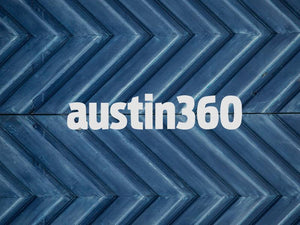 Stylish austin360 logo on a blue chevron patterned background, embodying Austin's vibrant culture.