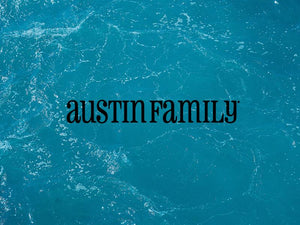 Austin Family logo on tranquil blue water background representing family connection and fun.
