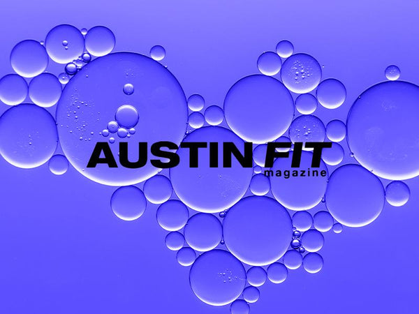 Austin Fit magazine logo with vibrant blue bubbles in a creative design.