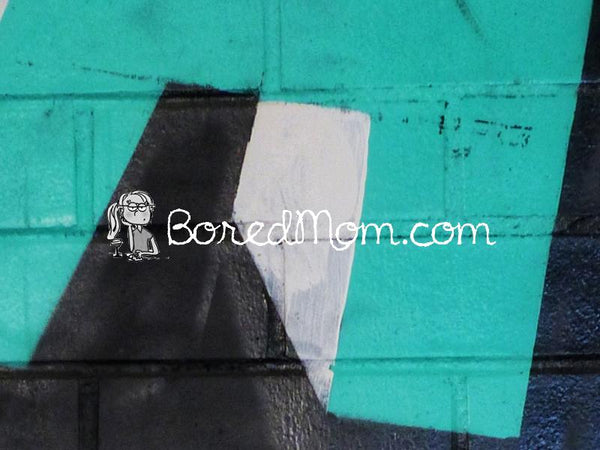 Graffiti art featuring vibrant teal and black colors with BoredMom.com logo.