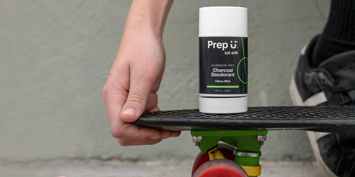 Young skater holding Prep u charcoal deodorant on skateboard, promoting natural hygiene for active lifestyles.