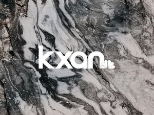 KXAN logo on a stylish marble background, representing Austin news and trends.