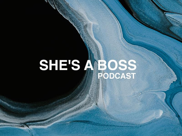 Abstract blue background with the text 'She’s a Boss Podcast' in white, representing empowerment and creativity.