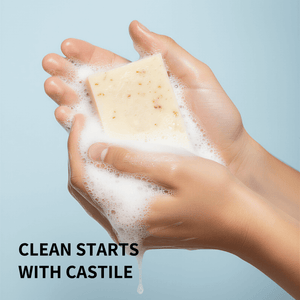 Hand holding a bar of Prep U soap with lather against a light blue background, featuring the text 'Clean Starts with Castile'.