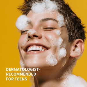 Teen with soap bubbles on face against a yellow background, dermatologist-recommended for teens text.