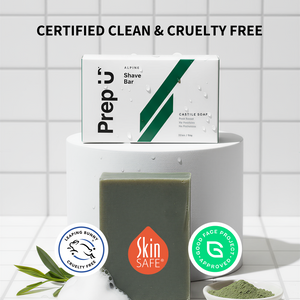 Shave bar with packaging on a white surface, featuring certification logos.