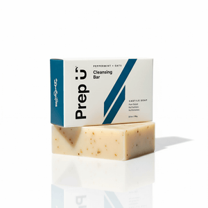Bar of soap with a box labeled 'Prep U Cleansing Bar' on a white background