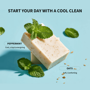 Two bars of soap with peppermint leaves on a light blue background, promoting a 'cool clean' experience.
