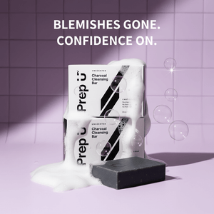 Prep U Charcoal Cleansing Bar with packaging on a purple tiled background