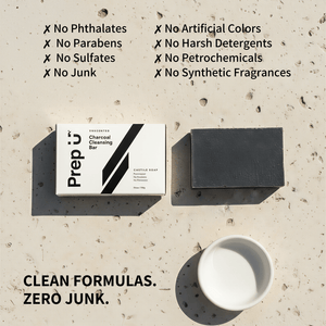 Bar of soap with packaging on a textured surface, featuring text about product ingredients.