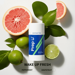 Prep U deodorant stick with grapefruit, lime, and leaves on a white background