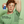 Teen holding a Prep U deodorant with green background and text about product ingredients.