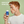 Redhead teen holding a blue and white natural deodorant labeled 'Prep U' with text 'Gentle on Sensitive Skin' on a green background