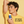 Teen holding a bottle of Prep Up deodorant against a yellow background with text 'Optimism in a Swipe'.