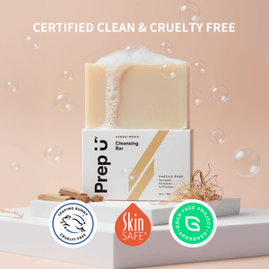 Bar of soap with packaging labeled 'Prep U' on a light pink background with bubbles.