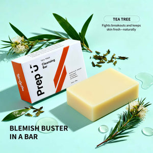Prep 10 Tea Tree Cleansing Bar with packaging on a light blue background with green leaves and flowers.