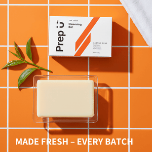 Prep U Cleansing bar soap with packaging on an orange tiled background