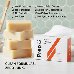 Stack of soap bars with a box labeled 'Prep U' on a light surface with a green tiled wall background.