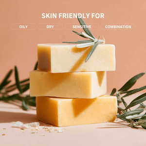 Three bars of soap stacked with olive leaves on a beige background, labeled 'Skin Friendly For' with skin type categories.