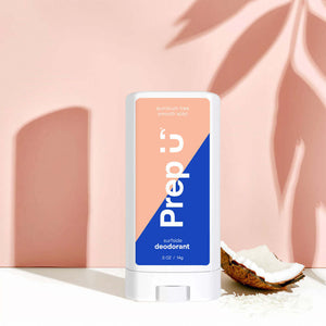Mini natural deodorant Surfside with coconut and vanilla scent against a pastel background.