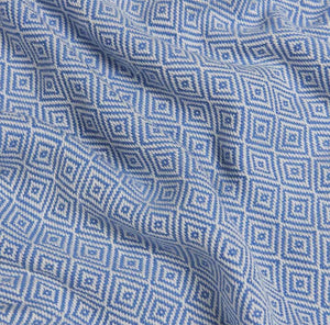 Close-up of blue and white geometric patterned fabric
