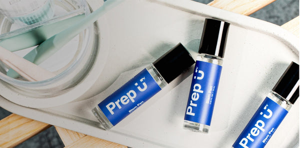 Three Prep U fragrance bottles stylishly arranged on a minimalist tray, perfect for freshening up anytime.