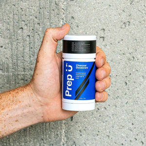 Prep U Aluminum-Free Activated Charcoal Deodorant in hand, showcasing effective, natural odor protection.