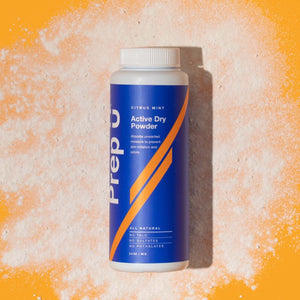 Bottle of Prep U Active Dry Powder in Citrus Mint flavor on a colorful background, perfect for preventing moisture and odor.